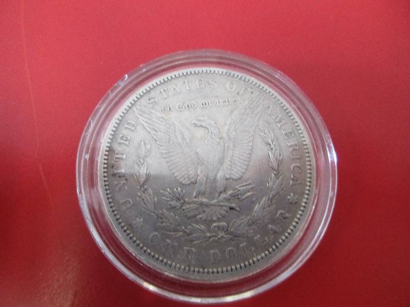 1882-P Morgan Silver Dollar in Airtight Protective Capsule.  The capsule can be easily opened if the winning bidder wishes to transfer to a collection folder.