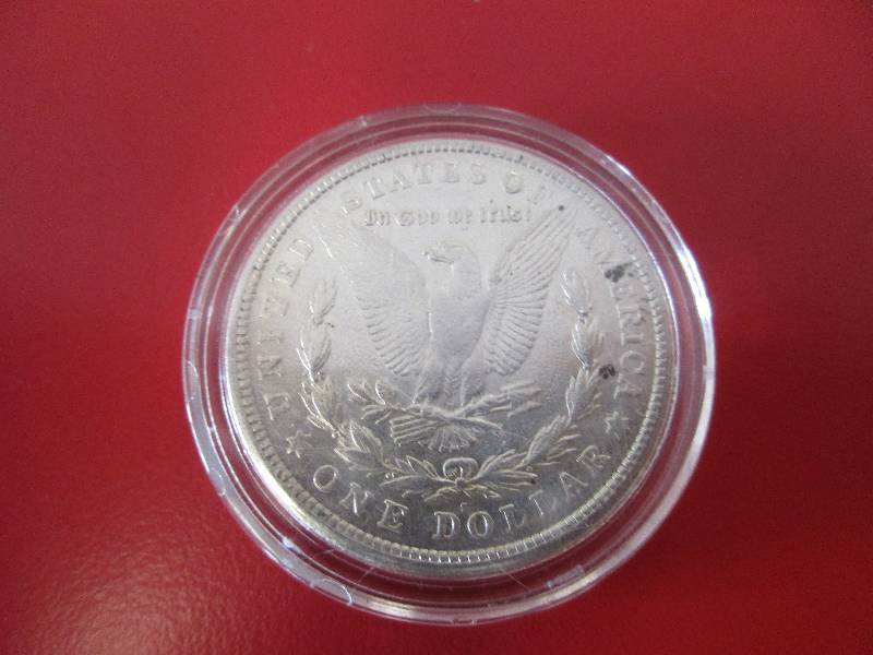 1921-S Morgan Silver Dollar in protective capsule. The capsule can be easily opened if the winning bidder wishes to transfer to a collection folder.
