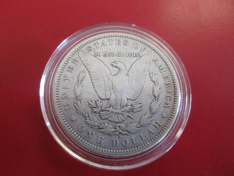 1897-S Morgan Silver Dollar in protective capsule. The capsule can be easily opened if the winning bidder wishes to transfer to a collection folder.