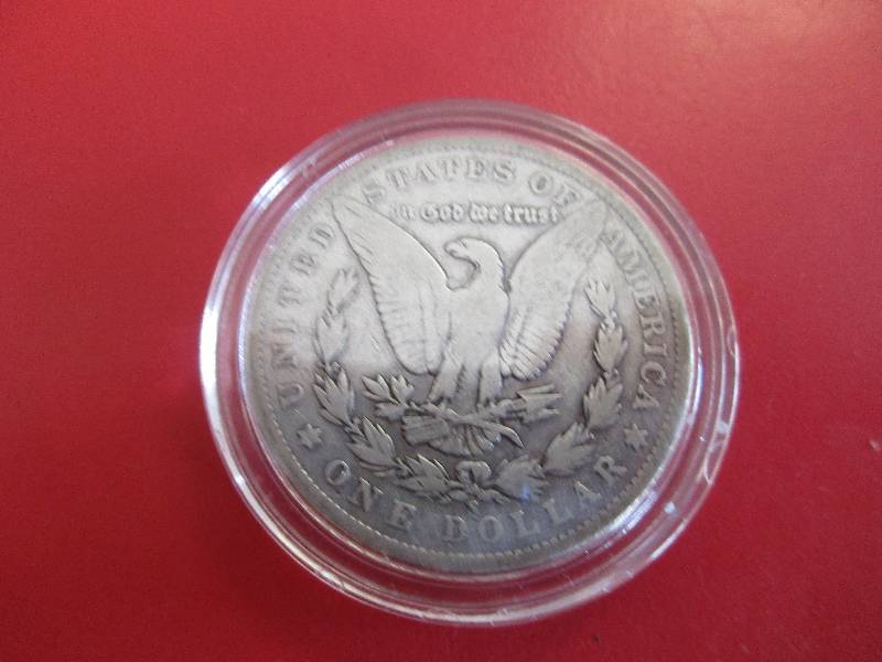1904-S Morgan Silver Dollar in protective capsule. The capsule can be easily opened if the winning bidder wishes to transfer to a collection folder. (HARDER DATE)