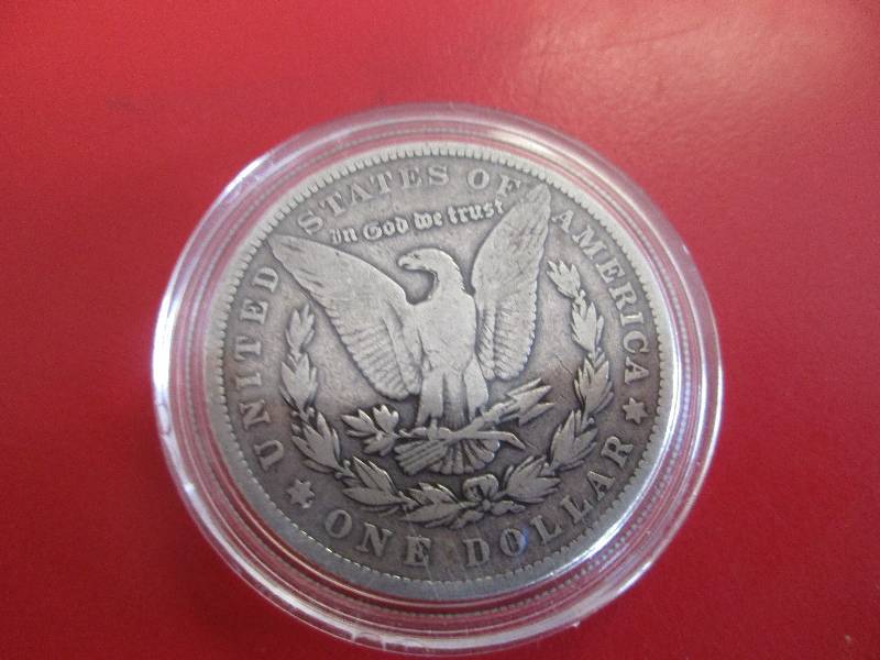 1902-P Morgan Silver Dollar in protective capsule. The capsule can be easily opened if the winning bidder wishes to transfer to a collection folder
