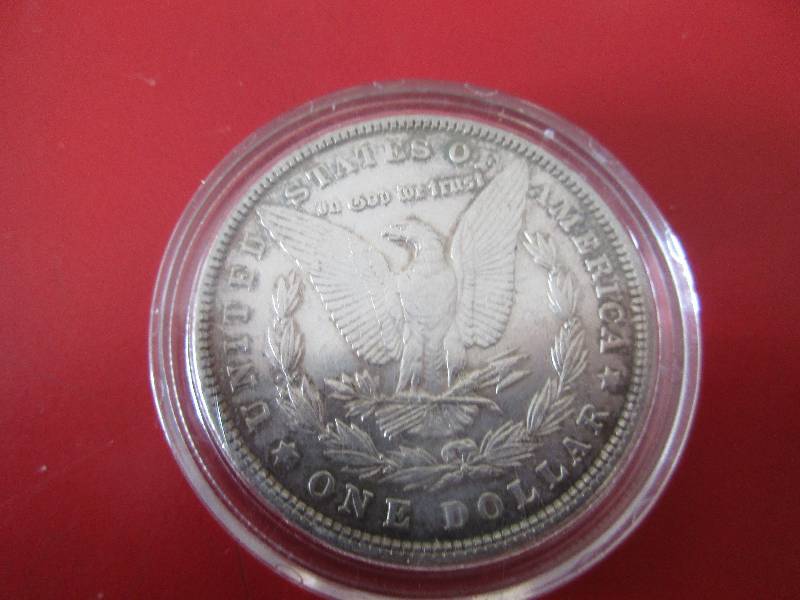 1903-P Morgan Silver Dollar in protective capsule. The capsule can be easily opened if the winning bidder wishes to transfer to a collection folder.