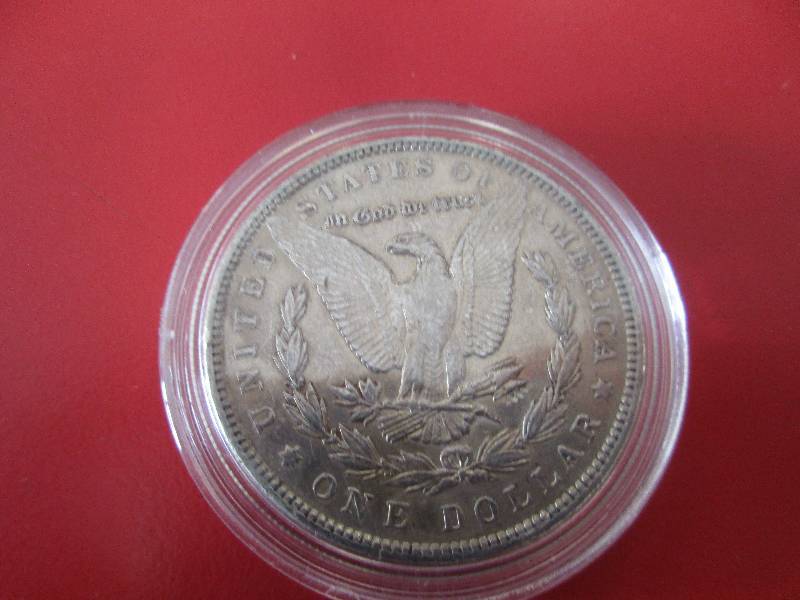 1890-P Morgan Silver Dollar in protective capsule. The capsule can be easily opened if the winning bidder wishes to transfer to a collection folder.