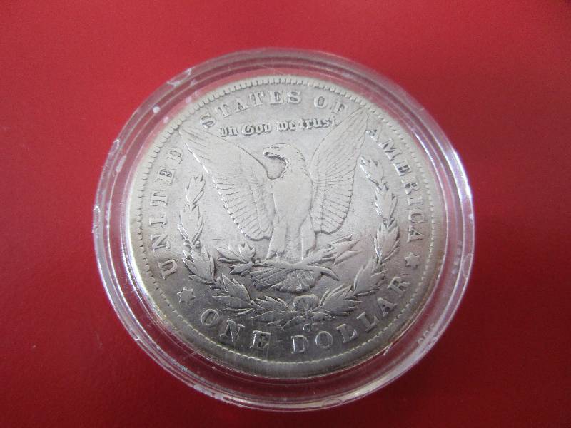 1883 CC Morgan Silver Dollar in protective capsule. condition (believed to be AU or better) good quality Carson City outside of a GSA holder.