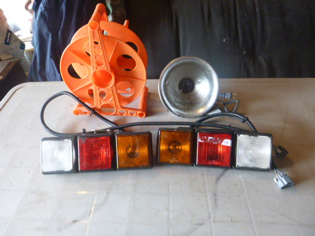 lot 15 image: Cord Reel, Clamp-On Light and 12 Volt Lights
