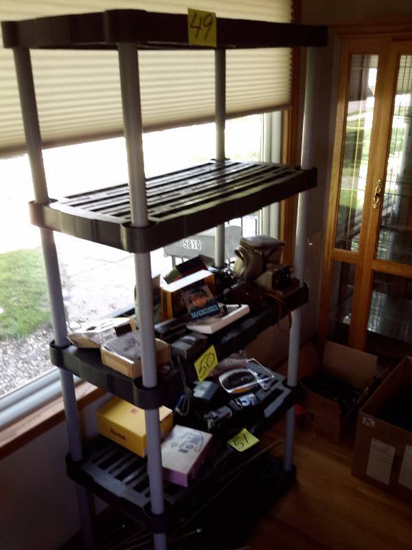 lot 49 image: Plastic 5 shelf stand.. Nothing on the shelves.. Sold in lots 5051