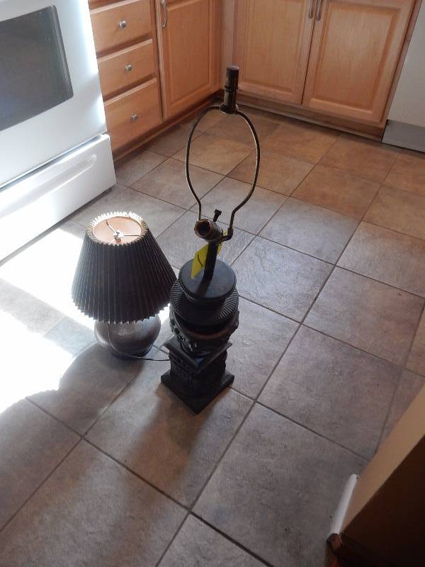 lot 41 image: Nice OLD table lamp.. Heavy metal with a Roman theme.. Needs to be put together. 34 in h.. Very nice Smaller table lamp.  Like a faux bronze base.. 17in h.