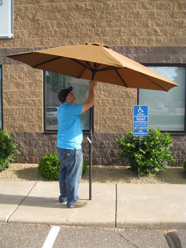 lot 42 image: 9 Tall Bronze Alum. Table Umbrella...