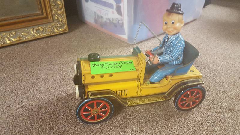 lot 77 image: 1950s Mego Sunday Driver Tin Toy