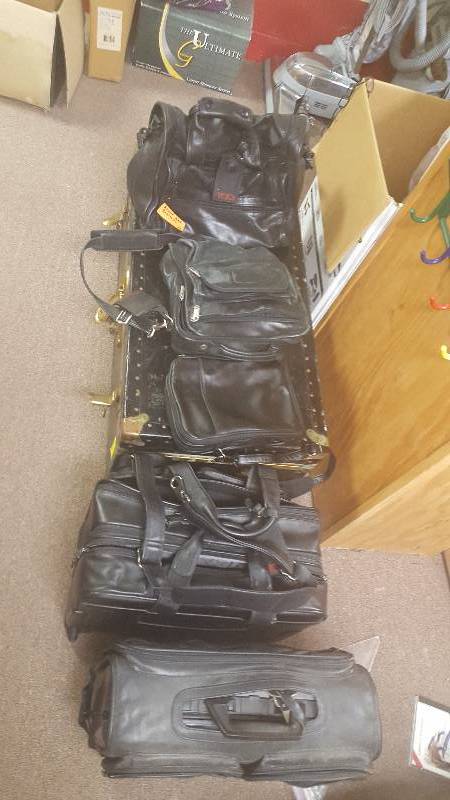 lot 99 image: Assorted Black Leather briefcases - some Tumi