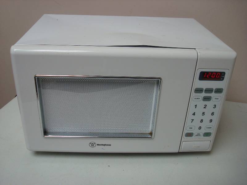 lot 27 image: Small White Microwave, Used, Some Wear, Works