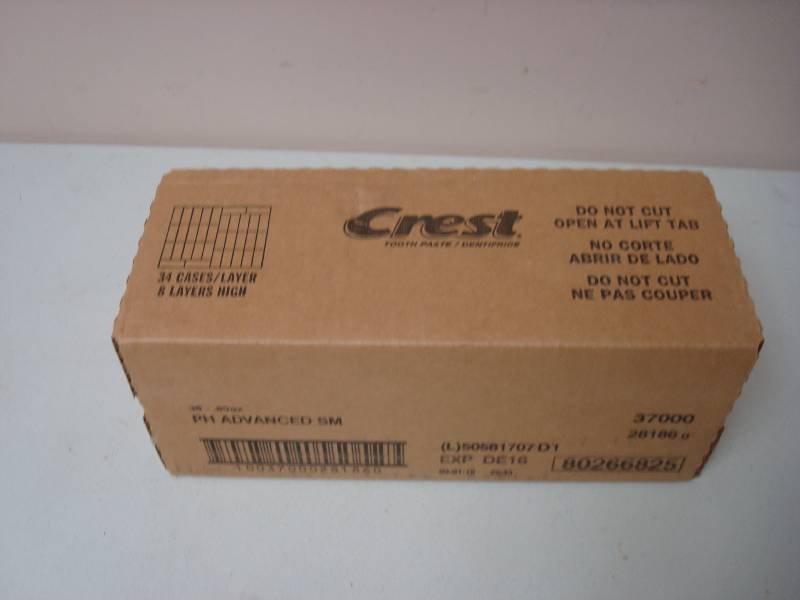 lot 61 image: Box Of New Travel Size Crest Toothpaste Expire 1216, 34 Tubes