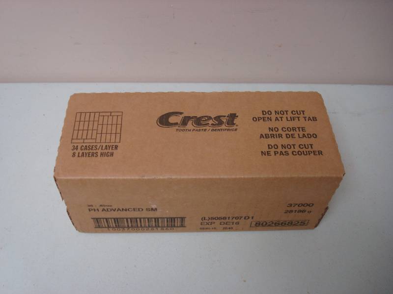 lot 62 image: Box Of New Travel Size Crest Toothpaste Expire 1216, 34 Tubes