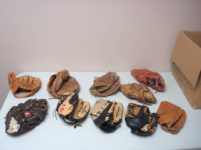 lot 78 image: Box Filled With Different Size Baseball Gloves, Used, Show Wear