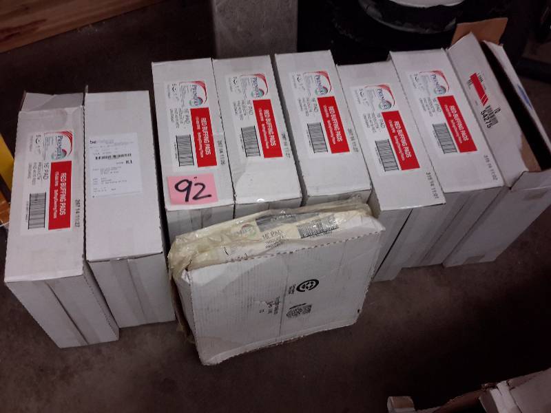 lot 92 image: 9 cases Premiere, Black Stripping pads, Red Buffing pads.  16in.