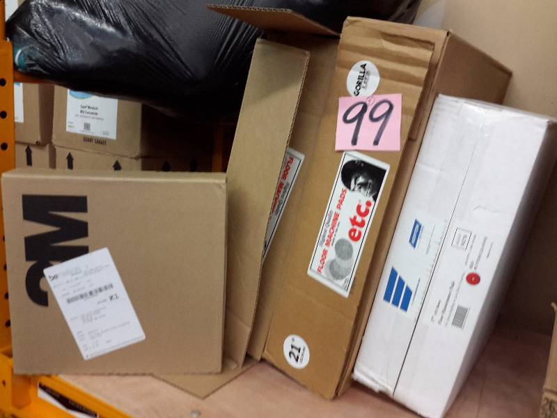 lot 99 image: 4 misc. Cases  1 case, Bertelson, 12in high prod. Stripping pads Etc. 2, open cases 21in Floor machine pads, Norton 17 in floor machine pads,