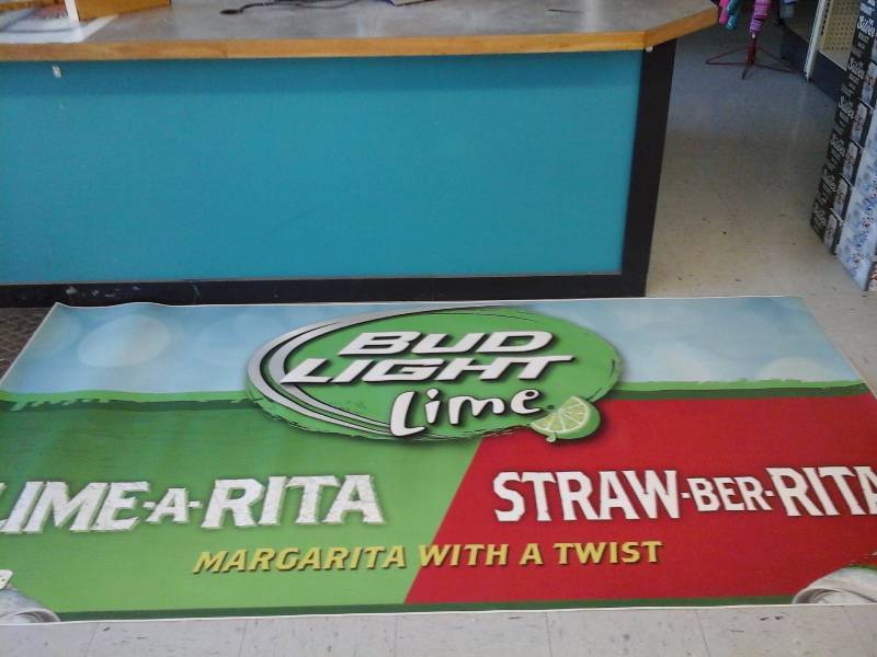 lot 280 image: Window Display Sign(Lime-A-Rita and Straw-A-Rita)