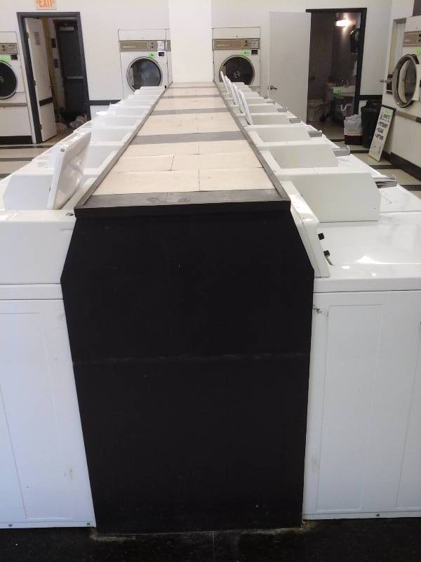 lot 409 image: Wood Cabinet(Hiding back of washers)