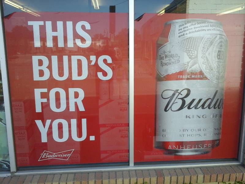 lot 84 image: Window Display Signs(2)(Budweiser Can and This Buds for You saying)