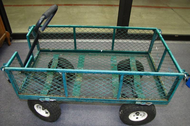 green metal lawn cart with pneumatic wheels