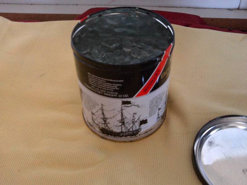 CLEAR GLASS MARBLES AND TABACCO TIN