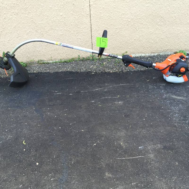 lot 15 image: Echo 2 Cycle 21.2 cc Curved Shaft Gas Trimmer  Model # GT-225 working conditions
