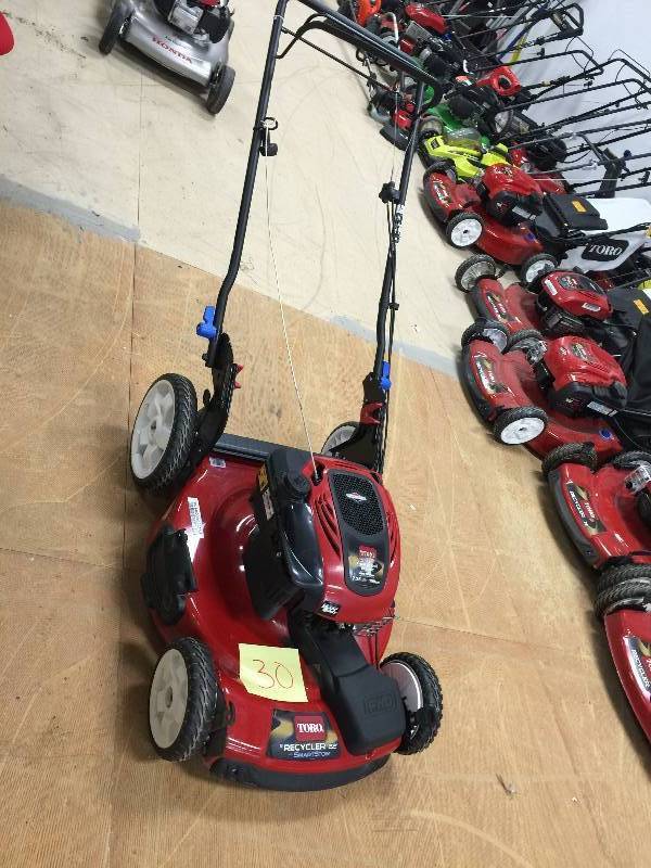 Toro 22 in. High Wheel Variable Speed Self-Propelled Walk-Behind Gas Lawn Mower with SmartStow in working conditions