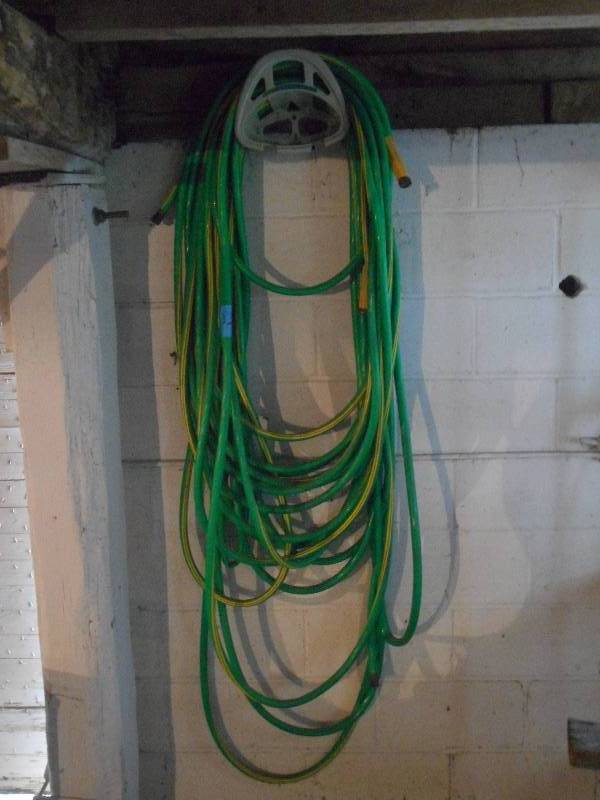 lot 83 image: Hose Rack With (2) Garden Hoses ...