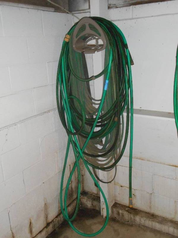 lot 84 image: Hose Rack With (3) Garden Hoses ...