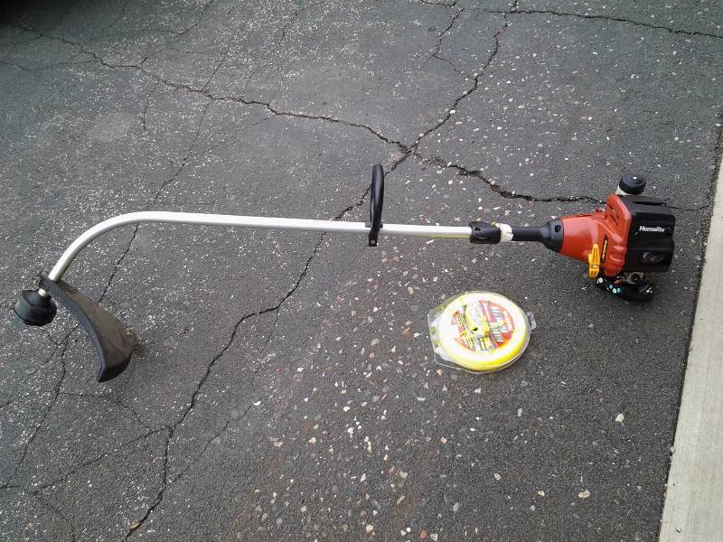 lot 11 image: Homelite Gas Powered Weed Whip (Runs, Cold Blooded To Start) Includes Reel Of Line