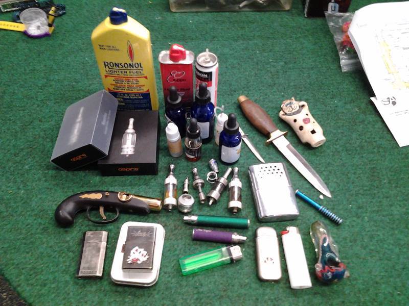 lot 19 image: Collection Of Lighters, Knives, E-Cig Parts