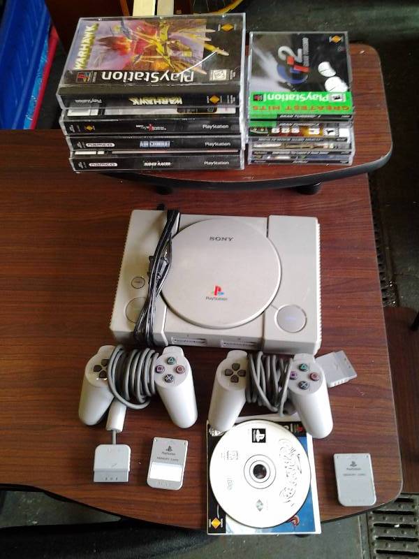 lot 29 image: Play Station 1 With Games, Remote Controls, Memory Cards