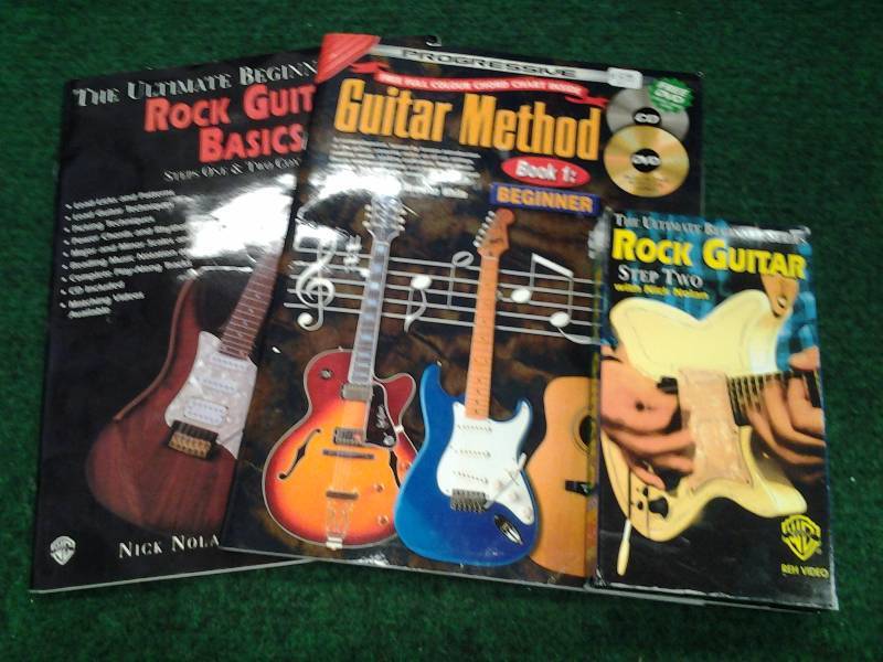 lot 38 image: 2 Beginner Guitar Books, 1 Video