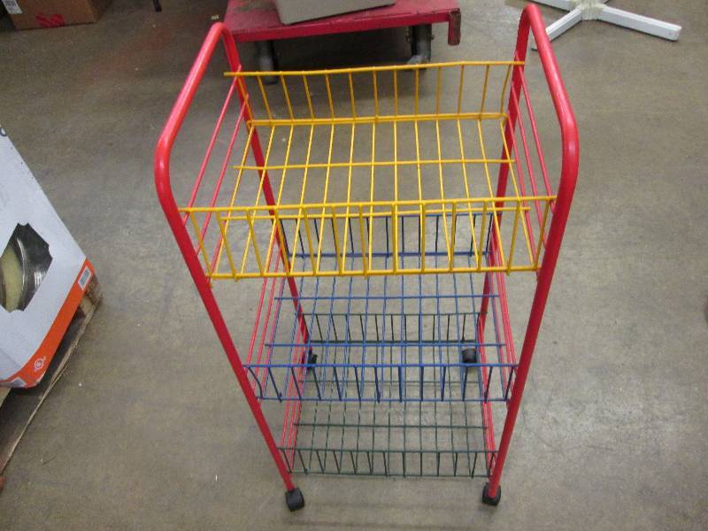 Multicolored plastic shelving on ca...