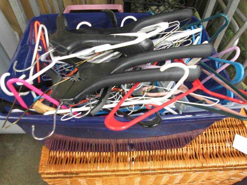 Blue tote containing assorted hange...