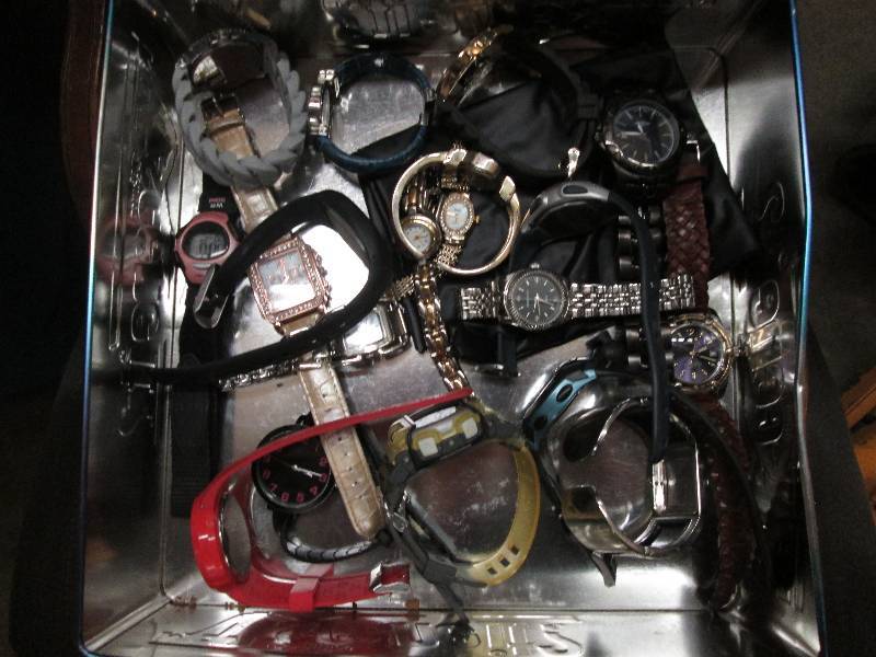 Lot of assorted watches in tin...