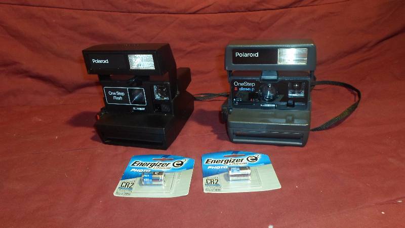lot 31 image: 2 Polaroid Instant Cameras with 2 CR2 Batteries