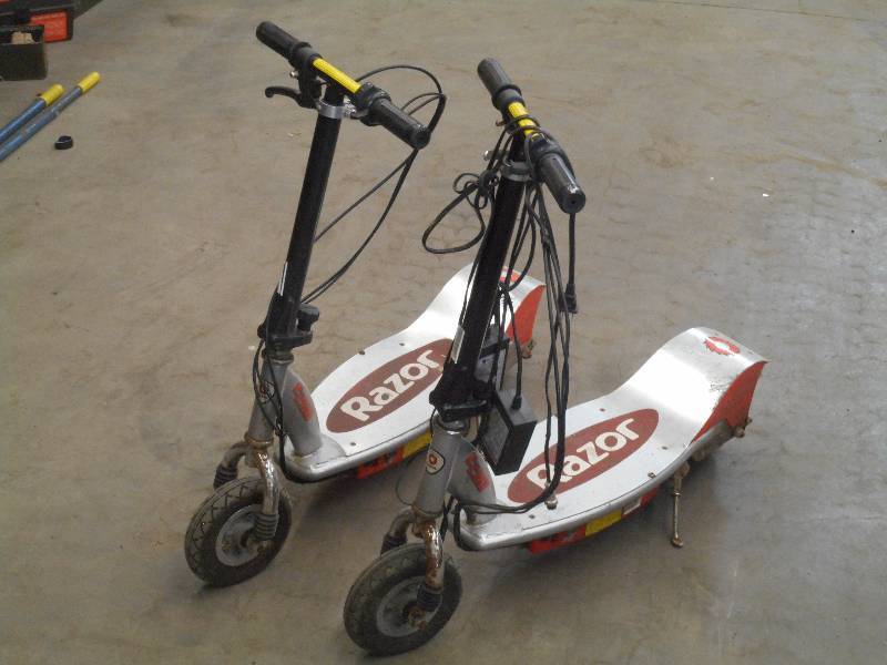 lot 114 image: (2) Razor Electric Scooters With Ch...