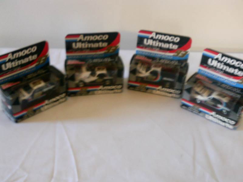lot 13 image: Amoco Ultimate Die cast  Racing Car set 164 scale, Set of 4 NEW