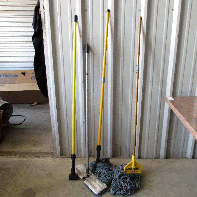 lot 25 image: THREE MOPS AND ONE MOP HANDLE