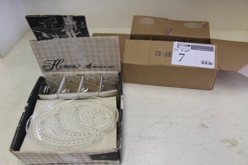 lot 7 image: Lot of (2) Boxes of Glassware Including 1) Homestead Snack Set AND 1) 11-Piece Glass Bottles