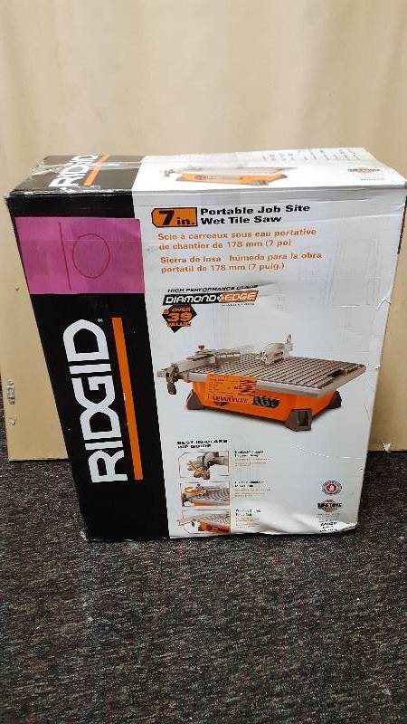 lot 10 image: Ridgid 7 in Wet Tile Saw new