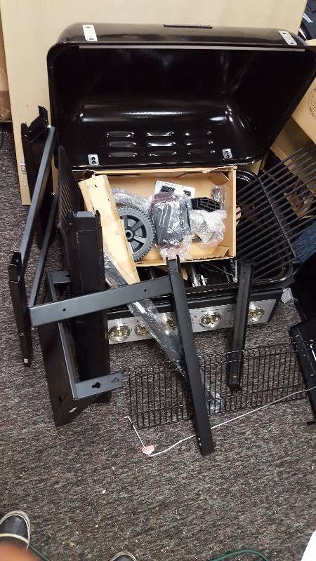 lot 12 image: Brinkman 4 Burner Gas Grill New but damaged on leg see pictures