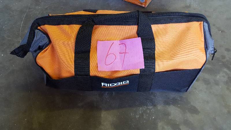 lot 67 image: Ridgid 18 volt Tools- Flashlight,drill driver, Saw, 1 battery and charger includes tool bag