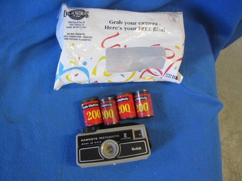 lot 58 image: Vintage camera with 4 tubes of flim...