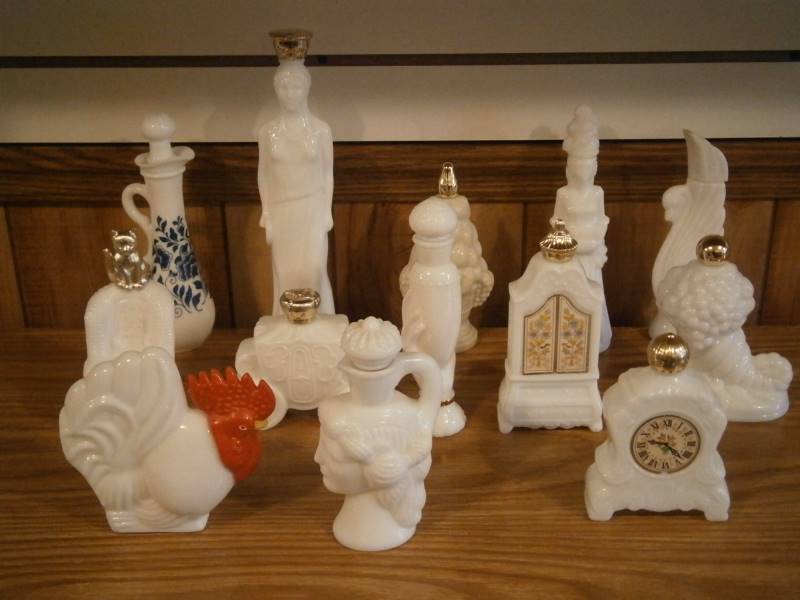 lot 27 image: (12) Avon Decanters (empty)