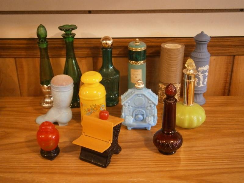 lot 36 image: (13) Avon Decanters (empty)