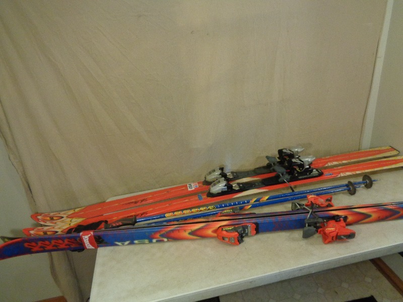 2 Pair of Skis, Boots, and 1 Pair of Poles
