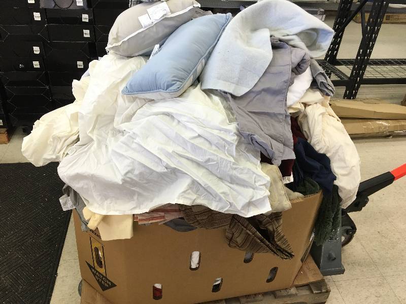 lot 93 image: Large gaylord of new sheets and curtains and bed sets  they just need to be sorted  these are new