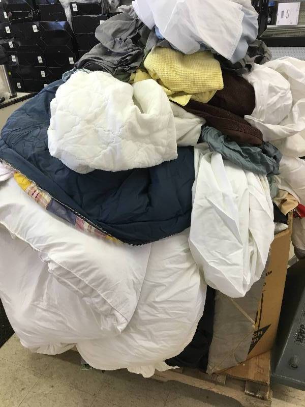 lot 94 image: Large gaylord of new sheets and curtains and bed sets  they just need to be sorted  these are new
